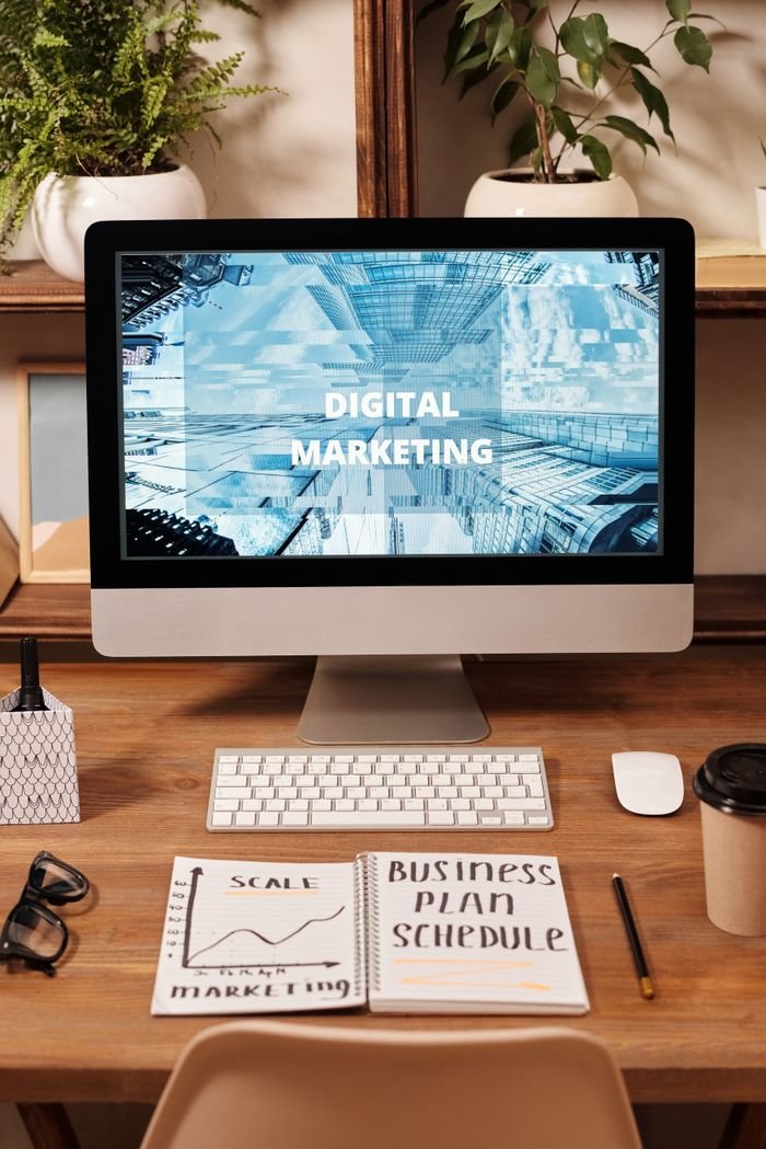 Home Contemporary office setup featuring digital marketing strategy on a computer screen, ideal for business technology themes.